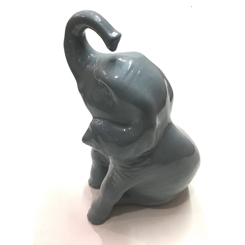 CERAMIC BABY ELEPHANT GREY. LENGTH AT LONGEST POINT 16 CM, WIDTH AT WIDEST POINT 11.5 CM, HEIGHT AT TALLEST POINT 28 CM. AVAILABLE IN DIFFERENT COLORS.-1