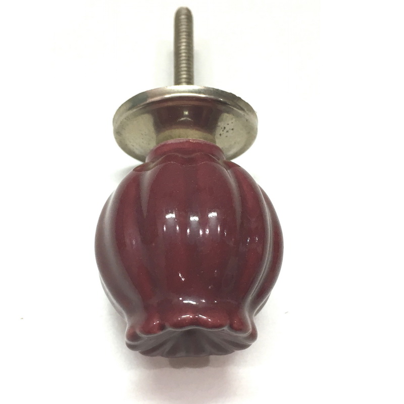 CERAMIC KNOB REDDISH BROWN. DIAMETER 35 MM. HEIGHT 38 MM, LENGTH OF SCREW OUTSIDE THE KNOB 41 MM. SUPPLIED WITH 1 SCREW, 1 BASE, 2 NUTS AND 1 WASHER.-1