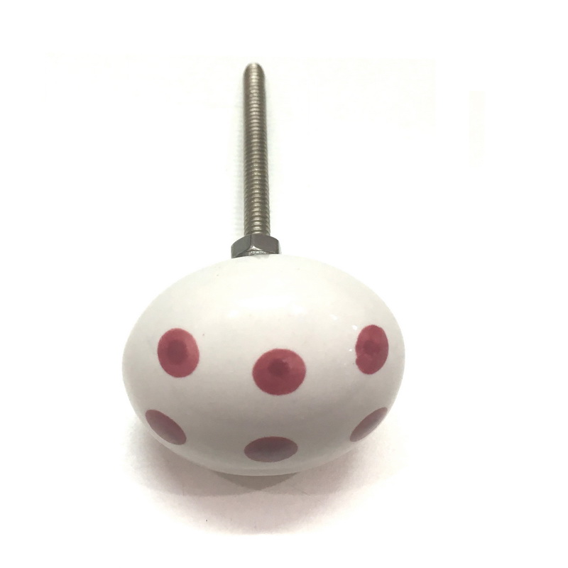 CERAMIC KNOB WHITE WITH RED POLKA DOTS. DIAMETER 40 MM. HEIGHT 28 MM, LENGTH OF SCREW OUTSIDE THE KNOB 54 MM. SUPPLIED WITH 1 SCREW ATTACHED, 2 NUTS AND 1 WASHER.-1